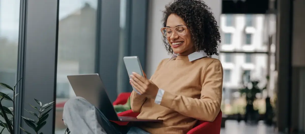 Person using laptop and phone