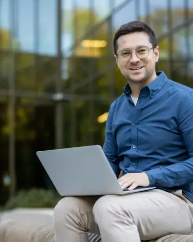 Smiling man with laptop