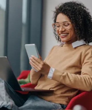 Person using laptop and phone